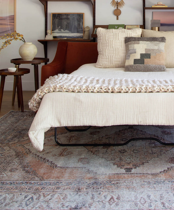 Red Contemporary Sleeper Sofa in Open Position with Cream Bedding