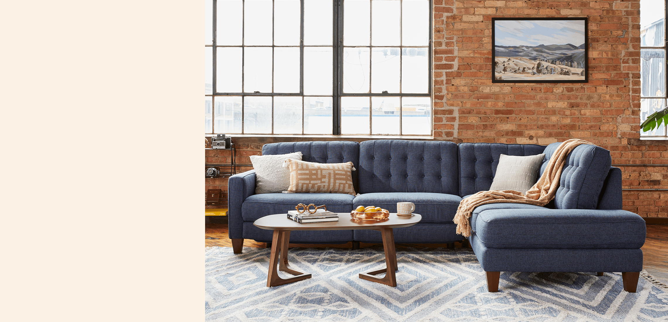 Blue Sectional on a brick background