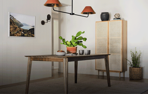 Black dining chairs in motion being added one by one around a brown rectangular table with a tan cabinet behind